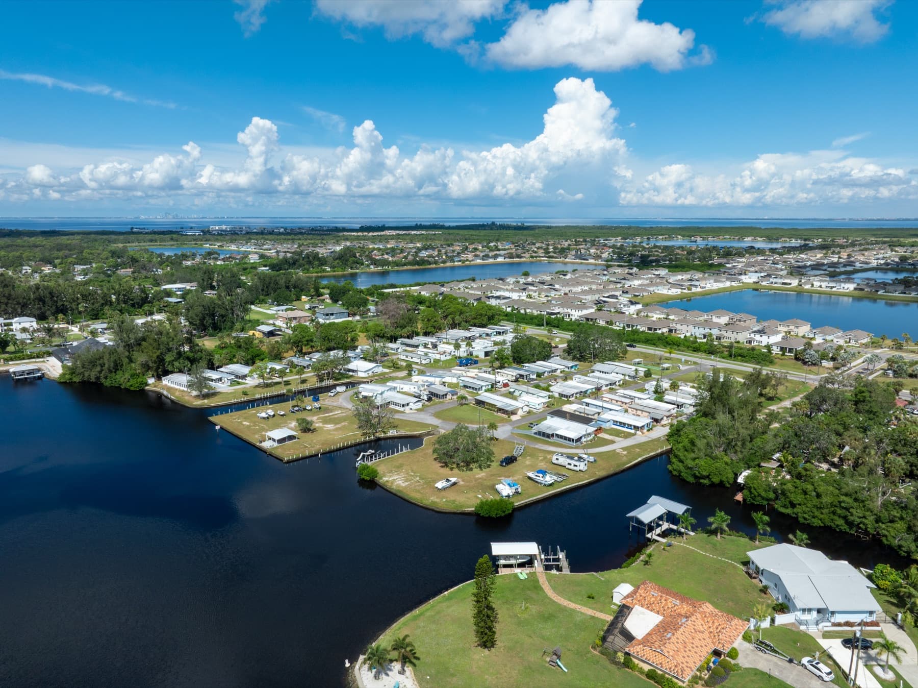 Wide aerial of the community along the bay