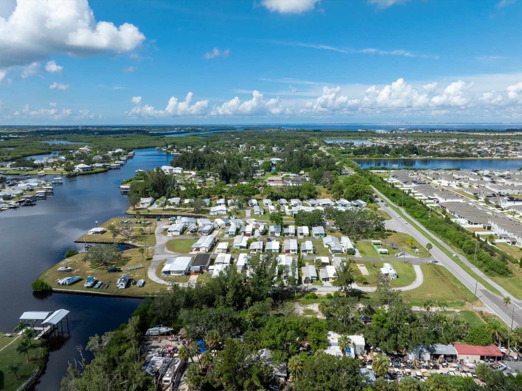 The community surrounded by water and greenery