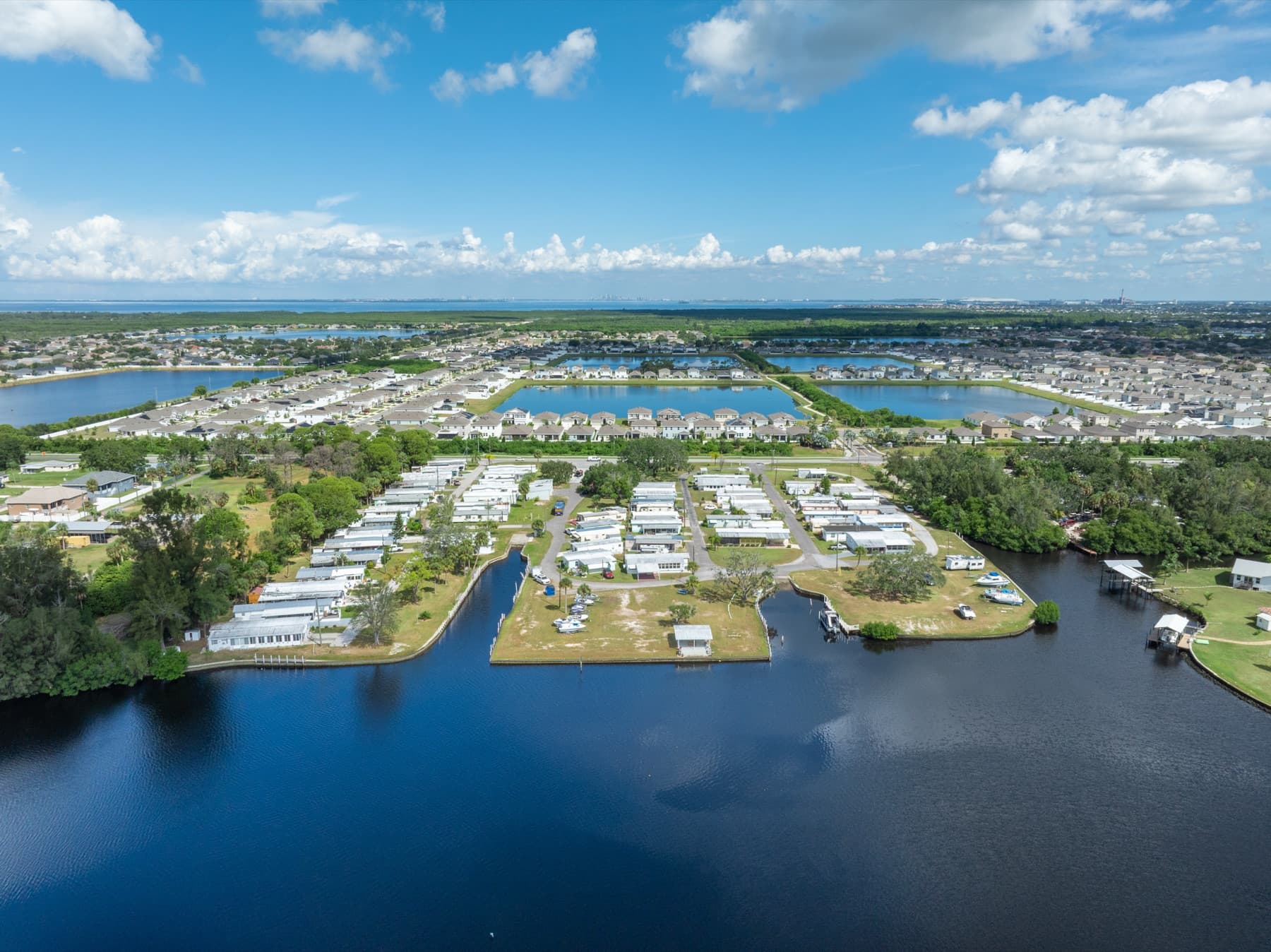 Sunset Bay homes sitting on a point surrounded by calm canals